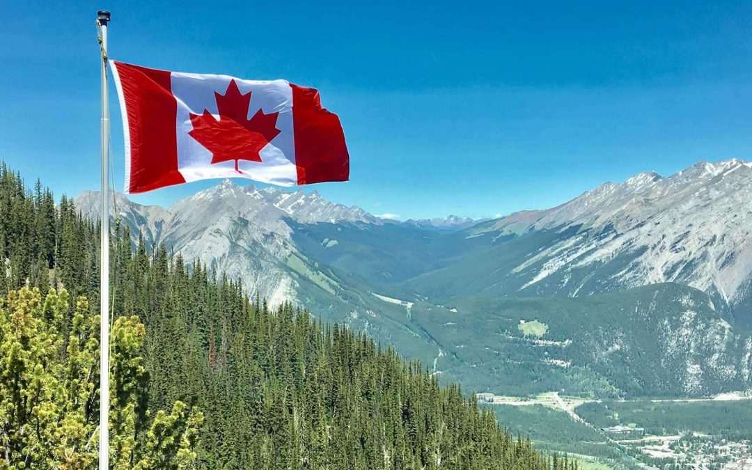 Canadian Flag on Mountain Range